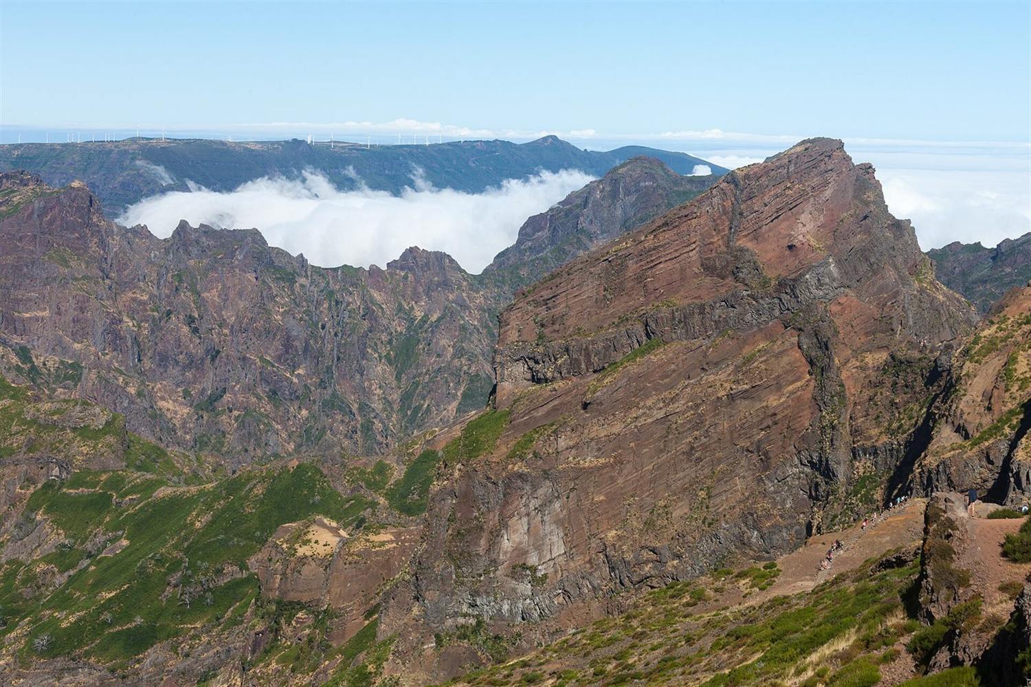 Rugged volcanic ridges of Pico do Cidrão seen from Pico do Areeiro, with a sea of clouds filling the valley, Madeira