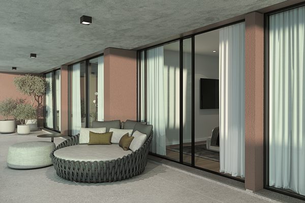 Developer's render of the balcony with a round day bed and planting