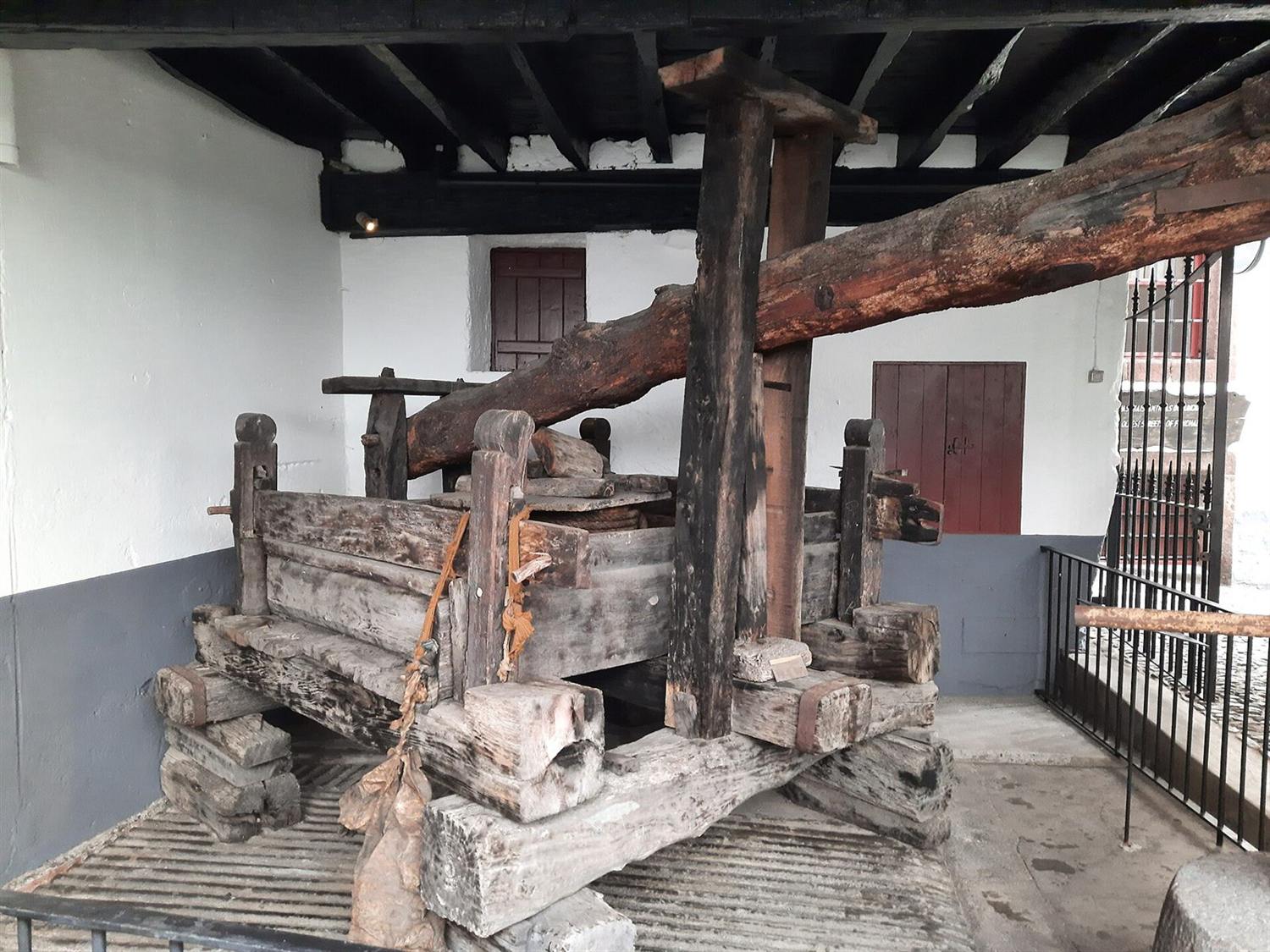 Old wooden wine press at Blandy's Wine Lodge in Funchal, Madeira